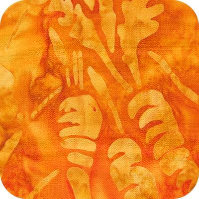 Orange batik fabric with abstract silhouettes and hand-like motifs