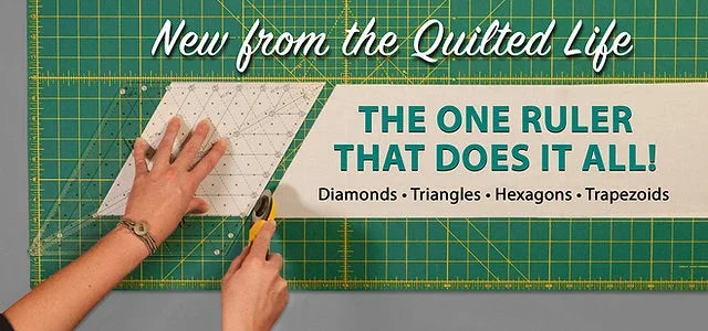 Quilting ruler overlay with 60° diamond scale, used on fabric with a hand