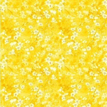 Yellow floral fabric with delicate white flower branches and tiny blossoms