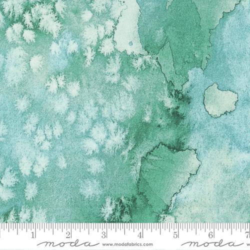 Green and teal printed fabric with abstract cloud-like pattern