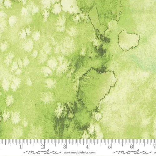 Green patterned cotton fabric with small motif and star-like shapes