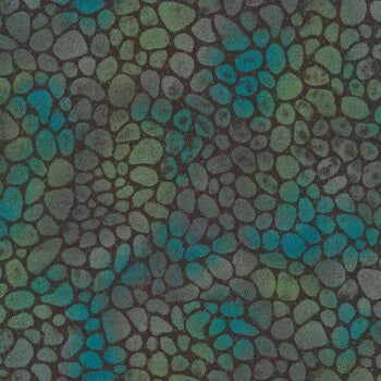 Quilt fabric with pebble-like leaf pattern in teal, blue, and dark green