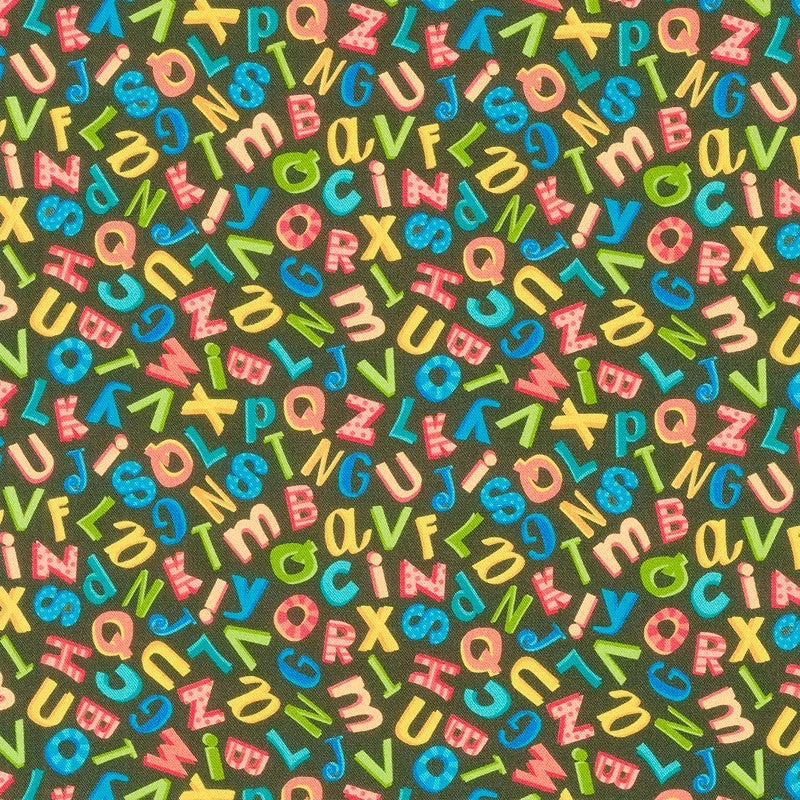 Alphabet soup print fabric with multicolor letters on a dark background