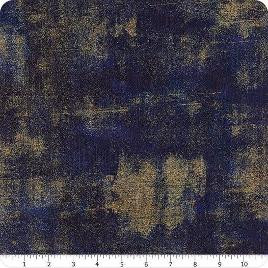 Grunge peacoat fabric swatch with dark navy and gold mottled pattern