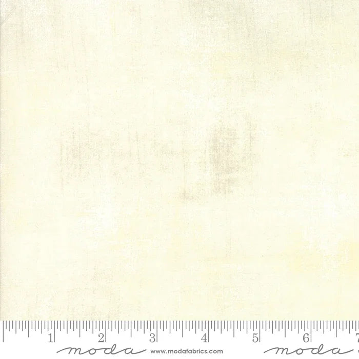Winter white grunge fabric swatch with mottled, textured pattern