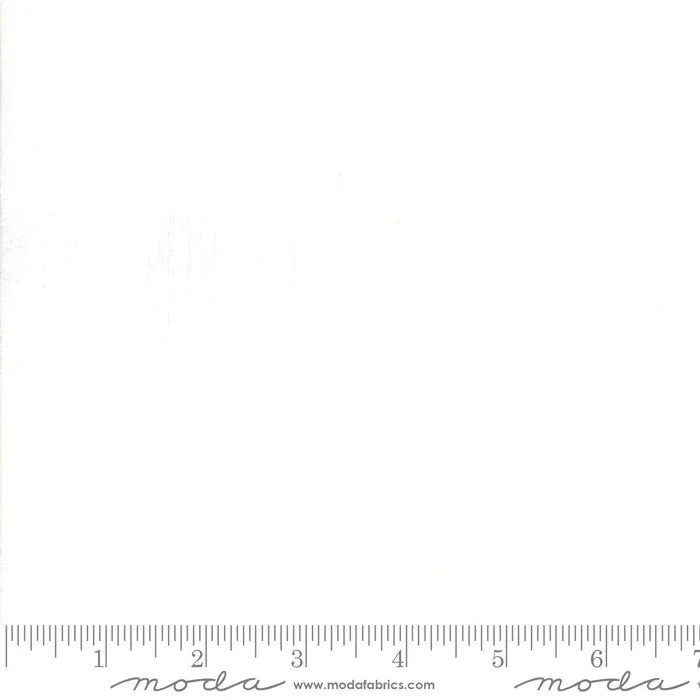 White paper sheet with subtle grunge texture and Moda Fabrics branding