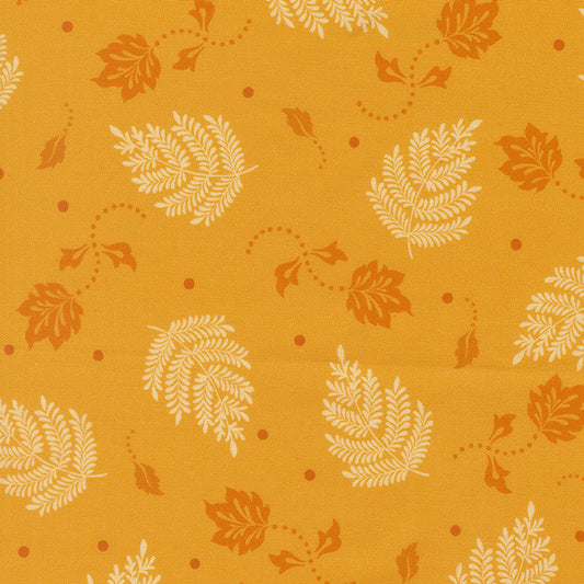 Dijon yellow paisley leaf patterned fabric with orange botanical details