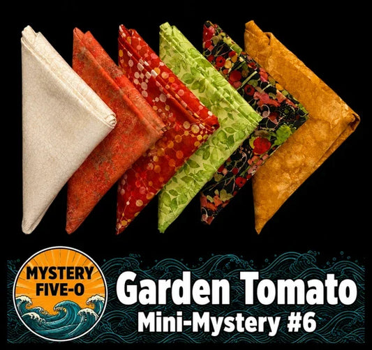 Mini mystery bundle of folded patterned fabric squares in assorted colors