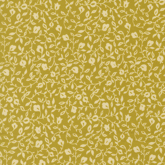 Floral leaf print fabric with small vines in light yellow-green