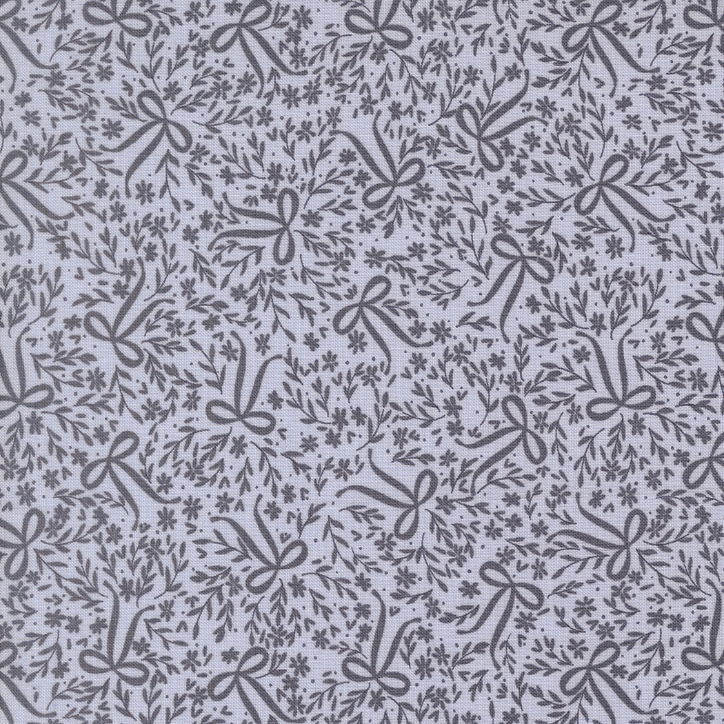 Wildbriar Sky floral quilting fabric with gray botanical vines and bows on a pale blue ground