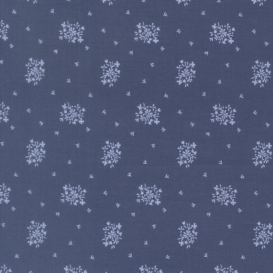 Moda Fabrics Wildbriar Maine Blueberry cotton fabric with a small white floral and leaf print on blue
