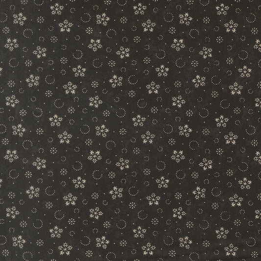 Ebony fabric with scattered gold snowflakes, circles, and small star motifs