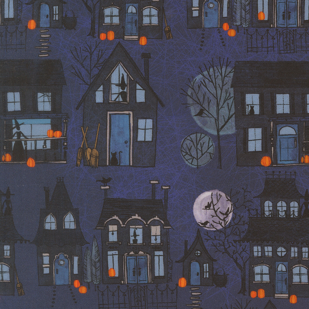Midnight witch village cotton fabric with blue houses, trees, pumpkins, and moon