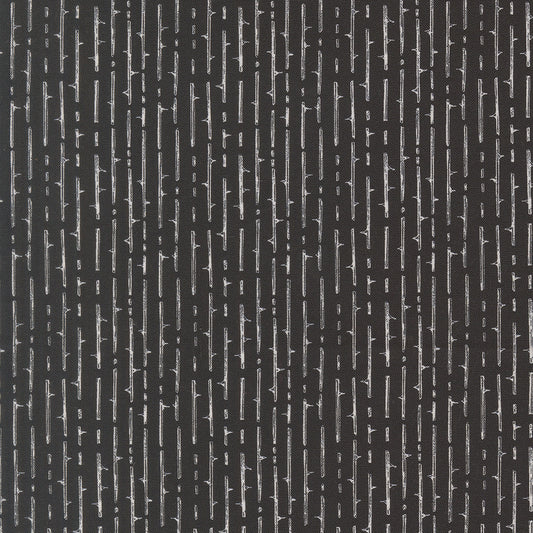 Black fabric with vertical striped pattern and jagged thorn-like motifs