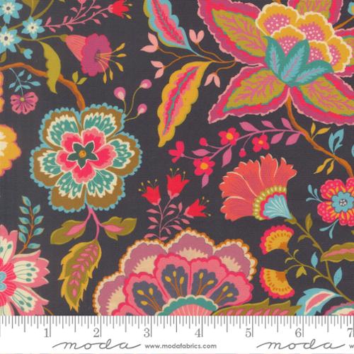Floral quilting fabric on dark navy with colorful pink, teal, and yellow flowers and leaves