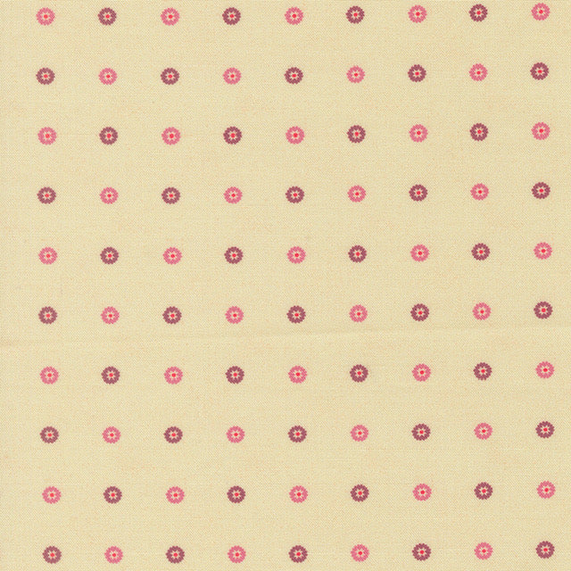 Cream cotton fabric with small pink and purple floret dot pattern
