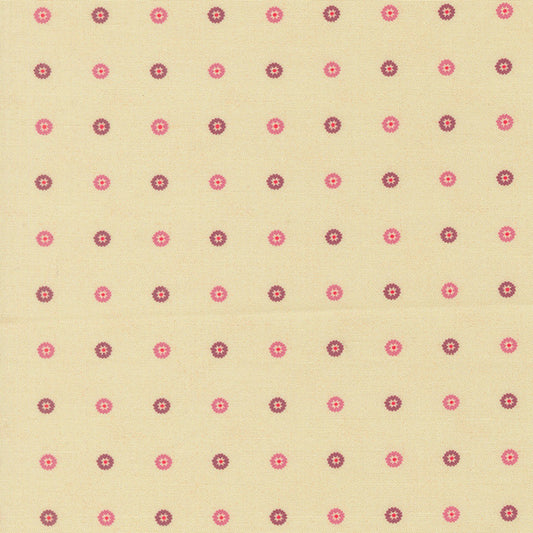 Cream cotton fabric with small pink and purple floret dot pattern