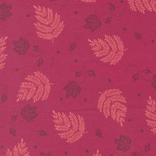 Quilting cotton fabric with scattered leaf and paisley motifs in pink and plum
