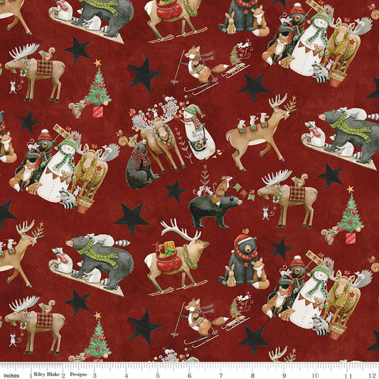 Red Christmas quilting fabric with repeating reindeer, elves, and toy soldiers