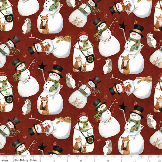 Red Christmas quilting fabric with snowmen, animals, candy canes, and stars pattern