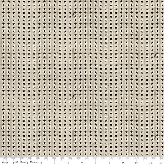 Cotton quilting fabric with vertical stripes of small white stars on dark background