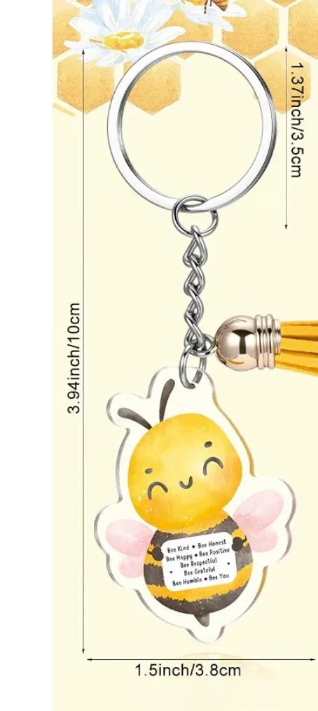 Bee-themed keychain with silver ring and yellow bee charm with pink wings