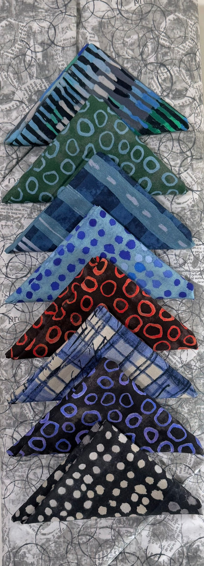 Set of five triangular patterned scarves in blue, green, red, and black