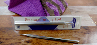 Precision turning tool with metal tip and handle, shown in retail box