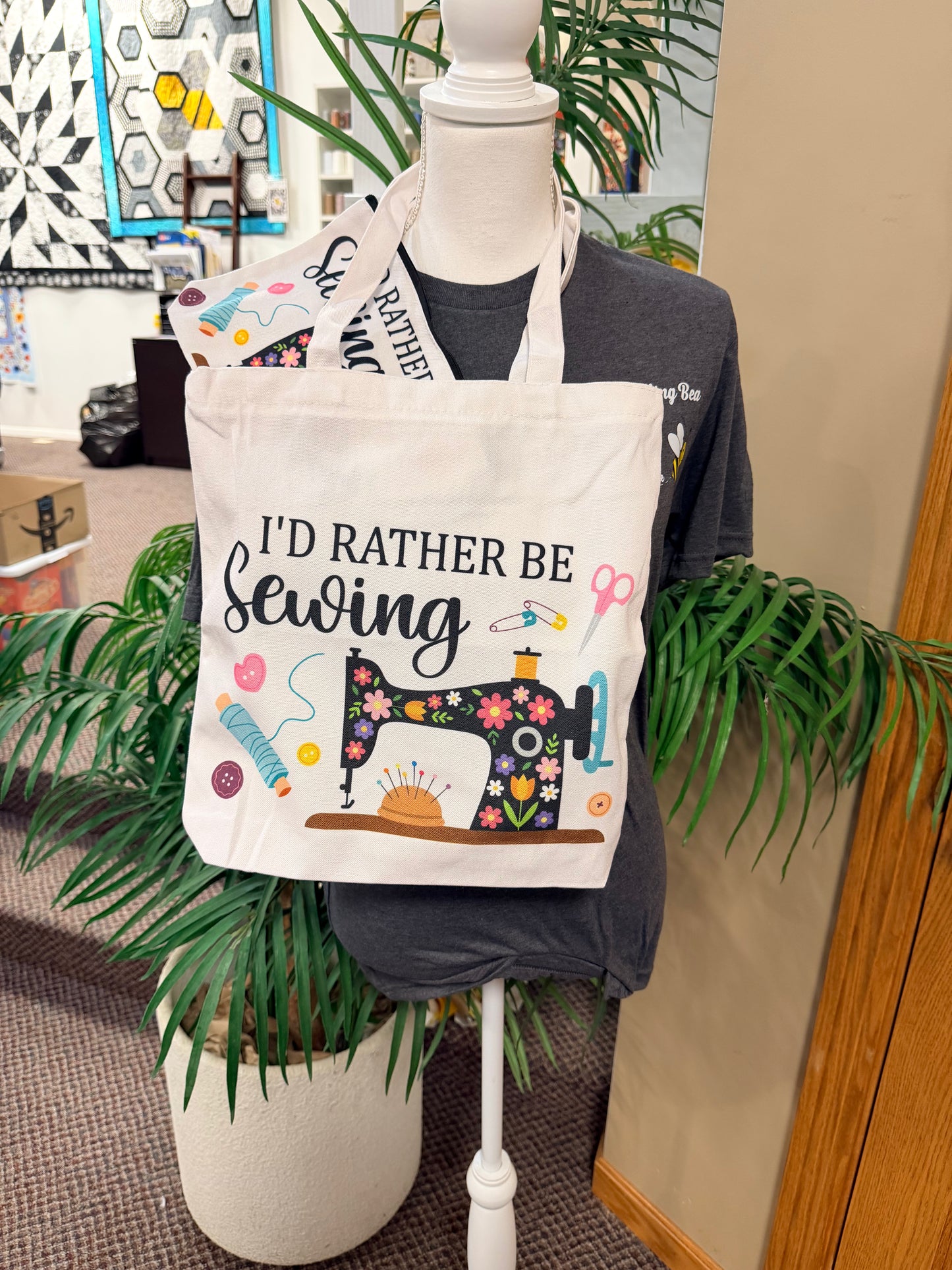 Cream canvas tote bag with "I'd rather be sewing" sewing machine print