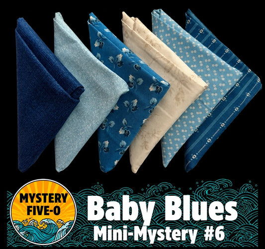 Mini fabric bundle with 5 folded blue baby blankets, floral and polka patterns
