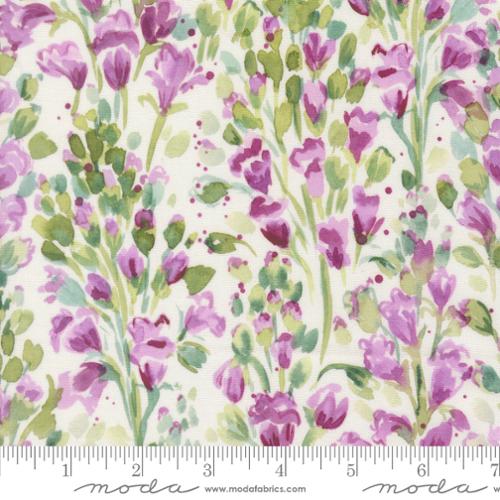 Floral cotton fabric with purple and green tulip flowers on a light background