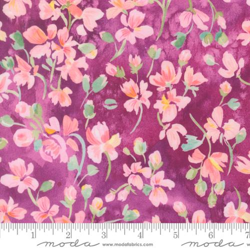 Floral fabric with pink, orange, and yellow blossoms on a deep purple background