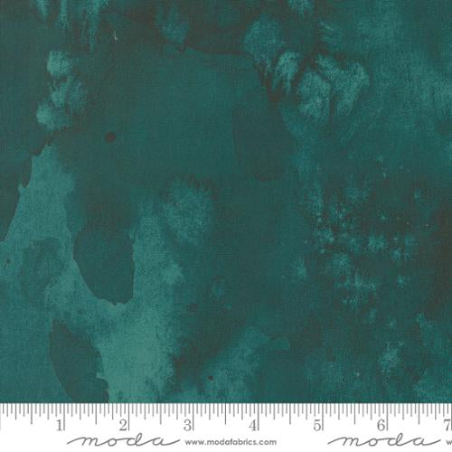 Dark teal floral abstract quilting fabric with flowing shapes and soft mottled texture