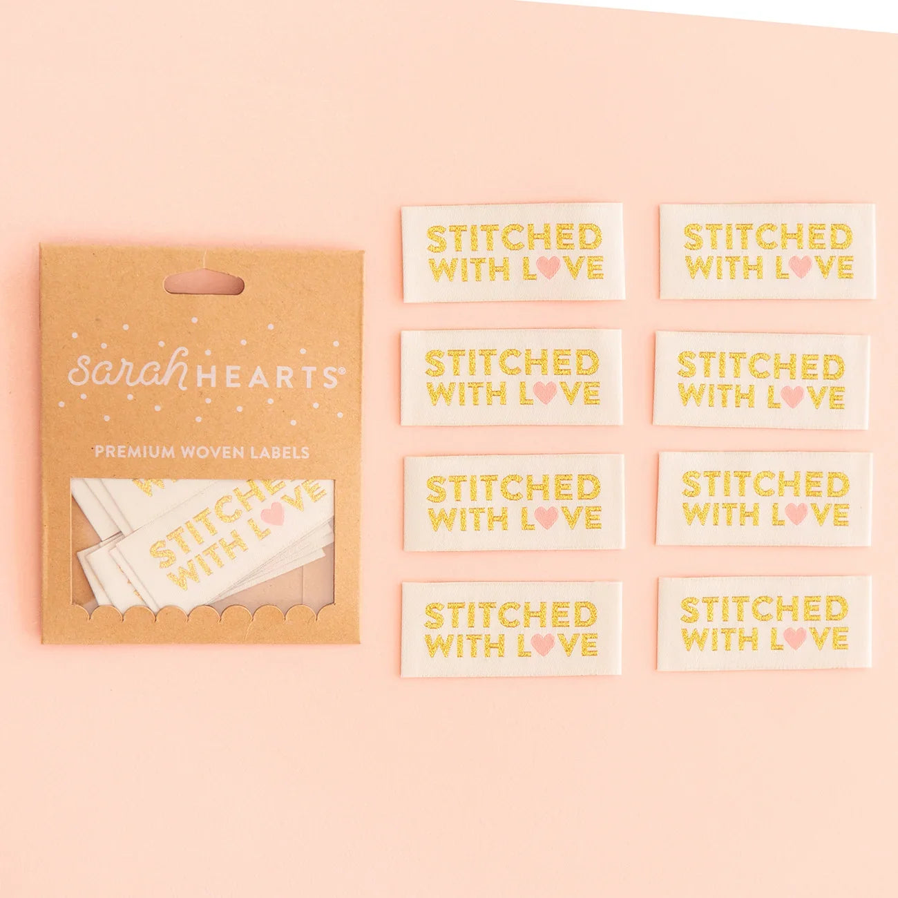 Gold woven labels set with "Stitched With Love" text, brand cards included