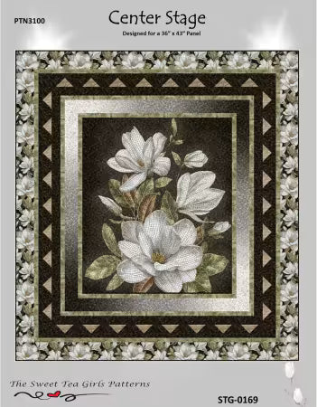 Center Stage quilt pattern featuring white magnolia flowers, layered borders and triangular accents
