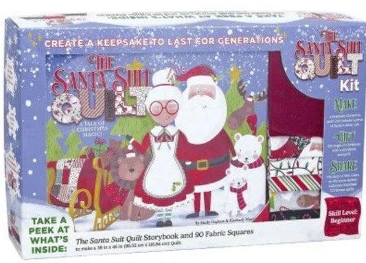 Santa Suit quilt kit box front with Santa, boy figure, and quilt-piece illustration