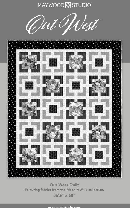 Quilt design with black frame, white square blocks, and floral print accents