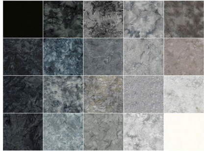 Assorted batik fabric squares showing marbled patterns from dark black to light gray