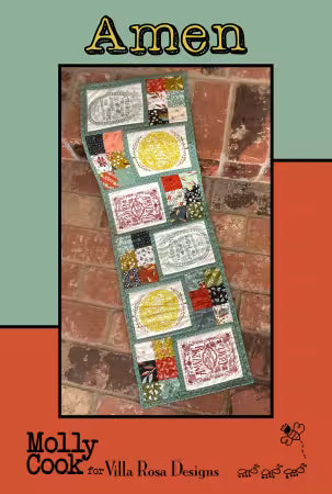 Amen quilt pattern featuring a long patchwork design with colorful blocks and circular motifs