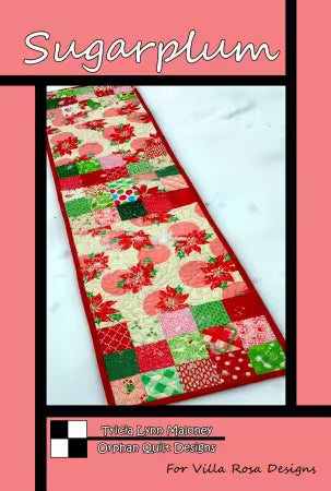 Sugarplum quilt pattern featuring a long patchwork runner in red, green, pink, and floral prints