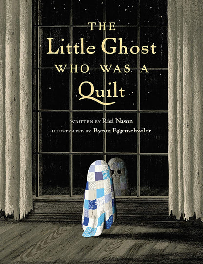 Blue-and-white patchwork ghost quilt with hooded body, standing upright.